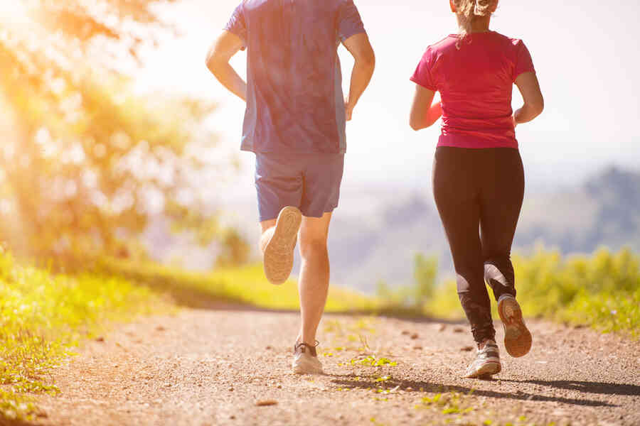 Two people running for exercise