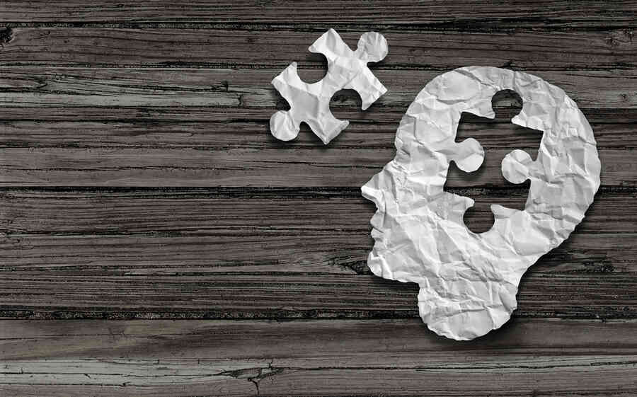 Mental health concept shown as a head with a puzzle piece missing